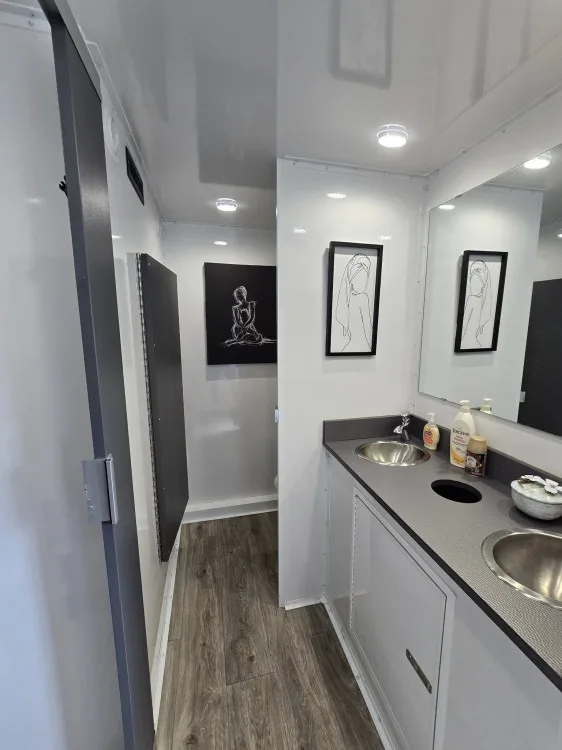 5-station ladies room with double vanity and open stall
