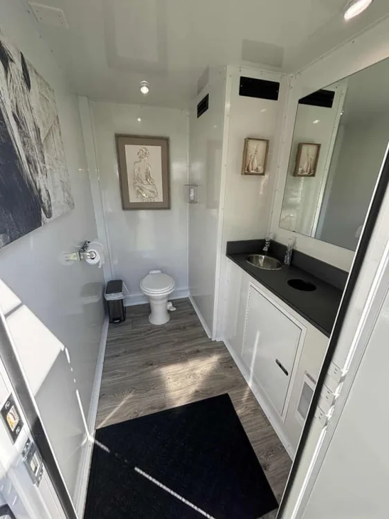 Interior of the Restroom Ranch 3-station luxury restroom trailer with a full vanity and mirror